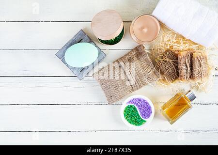 Different spa and bathroom products isolated on wooden background. Products for beauty treatments and body care Stock Photo