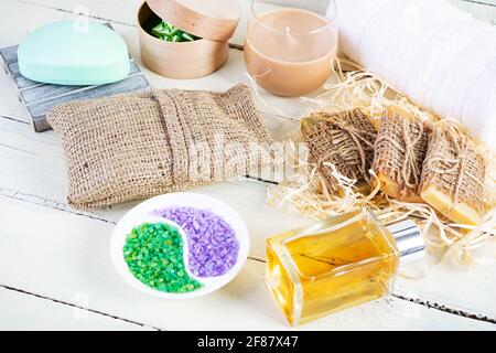 Different spa and bathroom products isolated on wooden background. Products for beauty treatments and body care Stock Photo