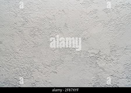 background old plaster small scratches. A gray concrete wall. Stock Photo