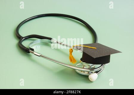 Medical education concept. Graduation cap and stethoscope. Stock Photo