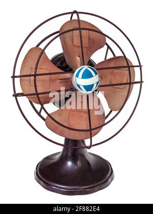 Early nineteenth century brown electric fan isolated on a white background Stock Photo