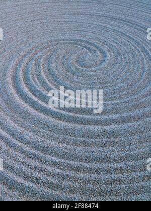 zen garden spiral of sand pattern Stock Photo