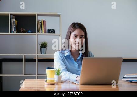 Portrait of Asian Business woman working from home. Accounting concept. Stock Photo