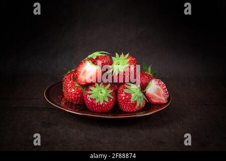 Fresh red strawberries in plate. Stock Photo