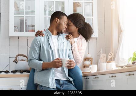 Domestic Romance. Portrait Of Young Black Affectionate Couple Bonding At Home Stock Photo