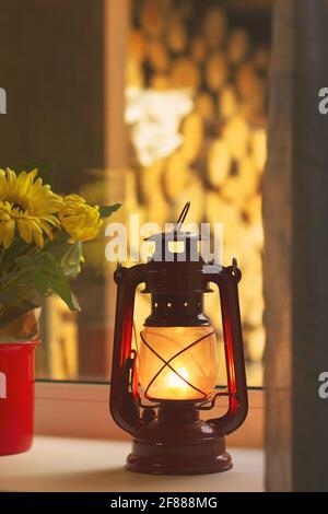 Kerosene lamp on the window. Old lamp Stock Photo