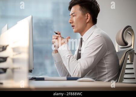 Young businessman working in office Stock Photo