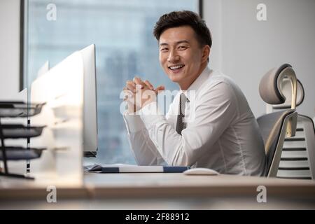 Young businessman working in office Stock Photo