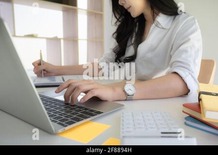 Portrait of Asian Business woman working from home. Accounting concept Stock Photo