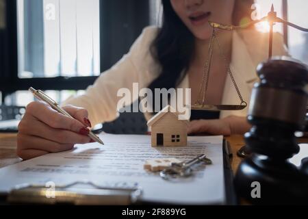 Lawyer checking agreement document before sending to client. Stock Photo