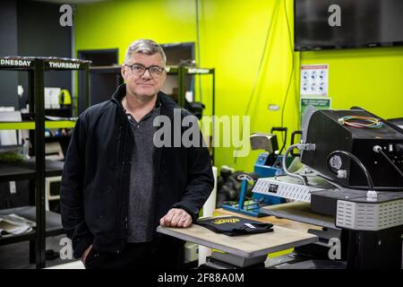 Stephen Seenan, Managing Director of Kopyright in Belfast, in his retail shop offering click and collect services, as lockdown restrictions are eased in Northern Ireland for the first time this year. Picture date: Monday April 12, 2021. Stock Photo