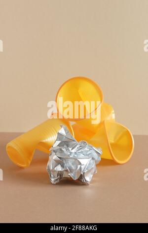 Crumpled empty plastic cups on monochrome background, isometric view, plastic waste, waste recycling, eco friendly packaging, sustainable industry con Stock Photo