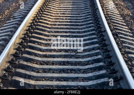 Railway track. Rail track is formed from rails, sleepers, fasteners. High quality photo Stock Photo