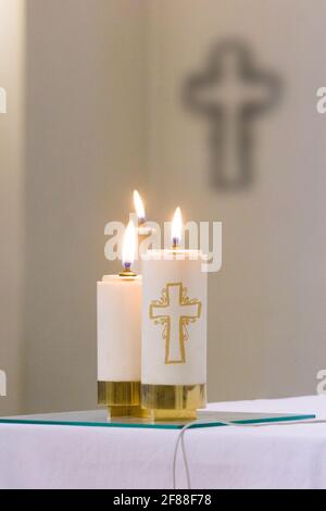 paschal candle with its light comes from the Holy Spirit and always accompanies the body of Christ Stock Photo