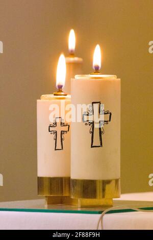 paschal candle with its light comes from the Holy Spirit and always accompanies the body of Christ Stock Photo