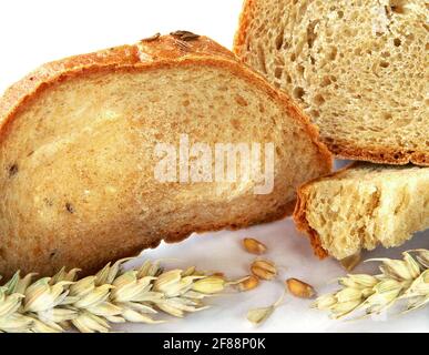 Sourdough bread with cumin in detail with cereals, slices, grains, corn, wheat - isolated on white background. Traditional fresh bakery. Stock Photo