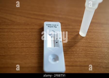 Positive test result by using rapid test device for COVID-19 Stock Photo