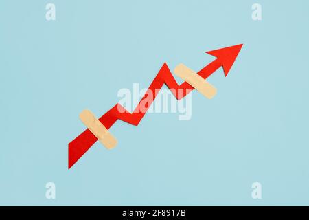 Global economy recovery, Business Economic growth. Financial, industrial and market sector comeback and upturn concept. Paper red arrow graph with Stock Photo