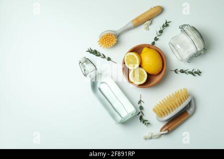 Cleaning concept with eco friendly cleaning tools and lemons on white background Stock Photo