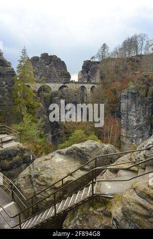 View to the Bastei bridge with stairs and paths at the saxon switzerland, Germany Stock Photo