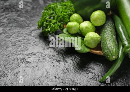 Healthy green vegetables on dark background Stock Photo