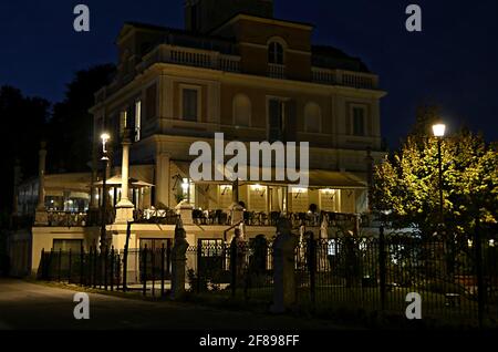 Nocturne view of the Neoclassical style Casina Valadier an elegant Italian fine dining restaurant and event hall in Villa Borghese, Rome Italy. Stock Photo