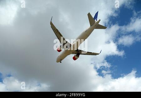 Commercial plane approaching Palma de Mallorca airport, just before entering the airport zone. Stock Photo