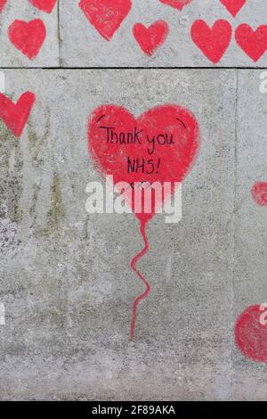 NHS frontline staff remembered in red hearts painted on the National Covid Memorial Wall, a tribute to the British victims of the Coronavirus pandemic
