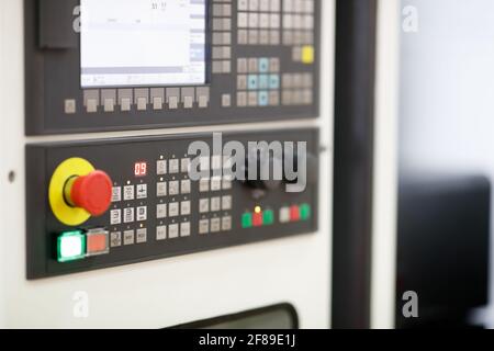 Modern CNC machine control operation panel. Selective focus. Stock Photo