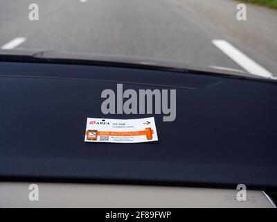 ticket of Toll Road operated by Area in Chambery Nord placed on the card dashboard Stock Photo
