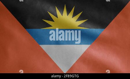 Antiguan and Barbudan flag waving in the wind. Close up of Antigua and Barbuda banner blowing, soft and smooth silk. Stock Photo