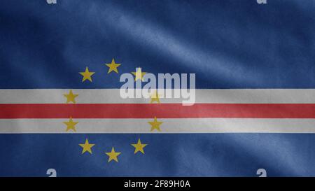 Cape Verdean flag waving in the wind. Close up of Cape Verde banner blowing, soft and smooth silk. Cloth fabric texture ensign background. Use it for Stock Photo
