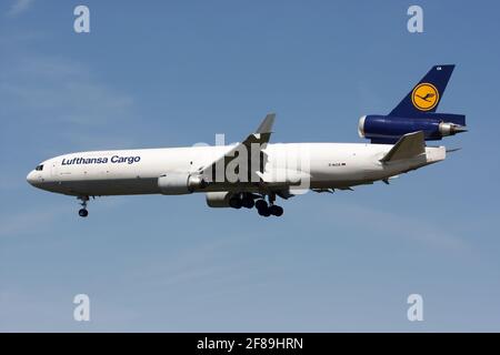 A Lufthansa Cargo McDonnell Douglas MD-11 freighter lands at Frankfurt Rhein-Main International Airport. Stock Photo