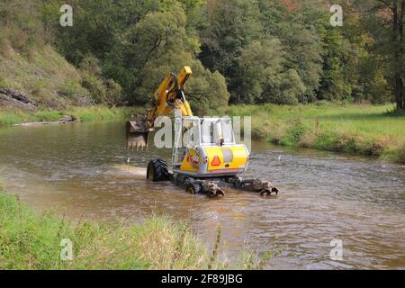 walking dredger working in the river - river bed restoration Stock Photo