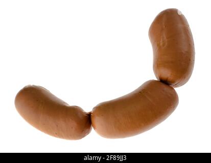 Three boiled sirloin sausages, on a white plate isolated Stock Photo
