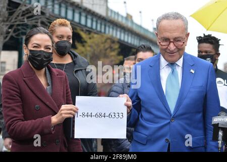 New York, USA. 12th Apr, 2021. Congresswoman Alexandria Ocasio-Cortez (l) and Senator Charles Schumer (r) announce the launch of the Federal Emergency Management Administration (FEMA) hotline to help pay for funeral and burial expenses for families who lost relatives to COVID-19, in the Queens borough of New York City, NY, April 12, 2021. Families can apply for up to $9,000 in relief to pay or be reimbursed for funeral expenses. (Photo by Anthony Behar/Sipa USA) Credit: Sipa USA/Alamy Live News Stock Photo