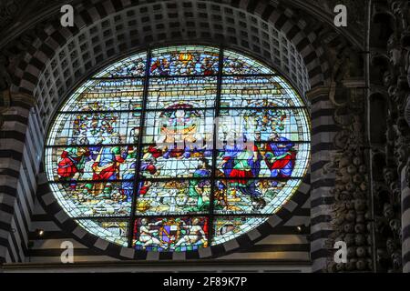 Siena, Italy.  Stained glass rose window depicting the Last Supper in the Cathedral of Santa Maria Assunta.  (For Editorial Use Only) Stock Photo