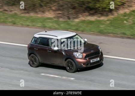 2014 Bronze Mini Countryman Cooper 5d, 1995 diesel SUV, driving on the M6 motorway near Preston in Lancashire, UK. Stock Photo