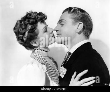 RITA HAYWORTH and JAMES CAGNEY Publicity portrait in THE STRAWBERRY BLONDE 1941 director RAOUL WALSH screenplay Julius J. and Philip G. Epstein based on play One Sunday Afternoon by James Hagan Warner Bros. Stock Photo