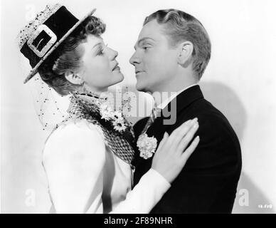 RITA HAYWORTH and JAMES CAGNEY Publicity portrait in THE STRAWBERRY BLONDE 1941 director RAOUL WALSH screenplay Julius J. and Philip G. Epstein based on play One Sunday Afternoon by James Hagan Warner Bros. Stock Photo