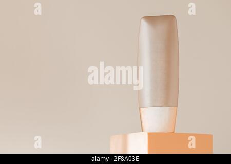 Foundation bottle mockup on podium pedestal, beige natural background Stock Photo