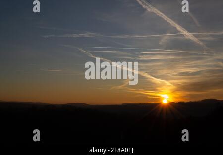 Beautiful sunset, orange horizon. Blue sky with cirrus clouds Stock Photo