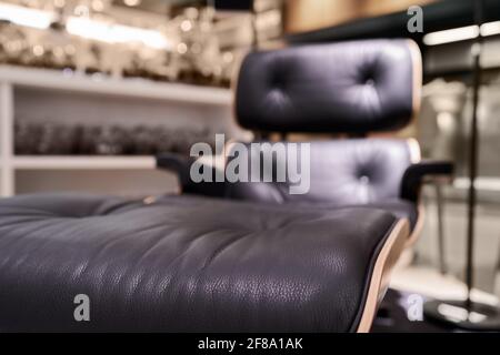 Modern office chair from black leather, comfortable adjustable armchair Stock Photo