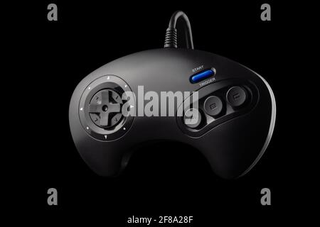 Retro joystick from 8-bit consoles. Game controller isolated on black background Stock Photo