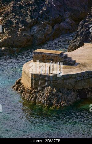trampoline and staircase on an artificial beach directly to the ocean in Ireland Stock Photo