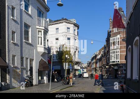 Outdoor sunny view  along Stationsstraat and Wycker Brugstraat street surrounded with retail shops, cafes and restaurants in Maastricht, Netherlands. Stock Photo