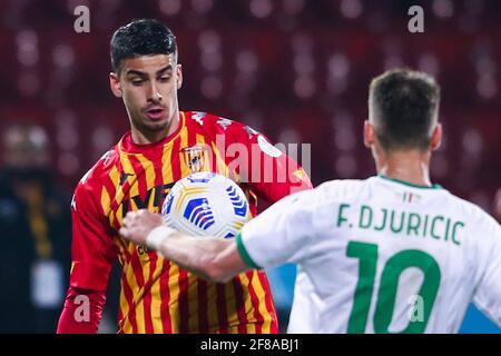 Benevento's Italian defender Fabio Depaoli challenges for the ball with Sassuolo's Serbian midfielder Filip Djuricic during the Serie A football match between Benevento and US Sassuolo  at the Ciro Vigorito Stadium, Benevento, Italy, on 12 April  2021 Stock Photo