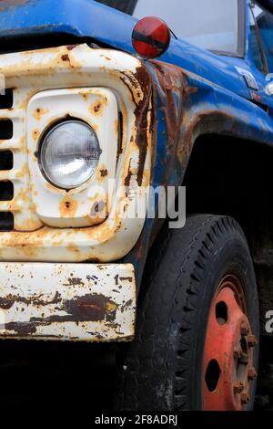 Colorful Close-Up of Vintage Blue Truck with Rust and Red Accents Stock Photo