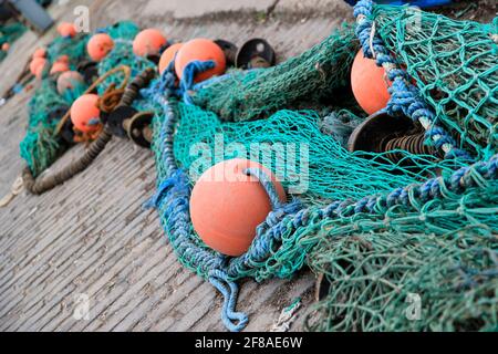 Colorful Fishing Nets in Harbor of Crail, Scotland Stock Photo