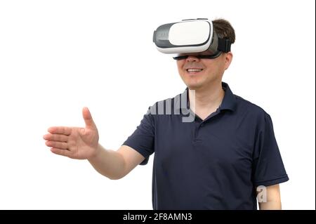 Man wearing virtual reality goggles. Studio shot, white background. Stock Photo